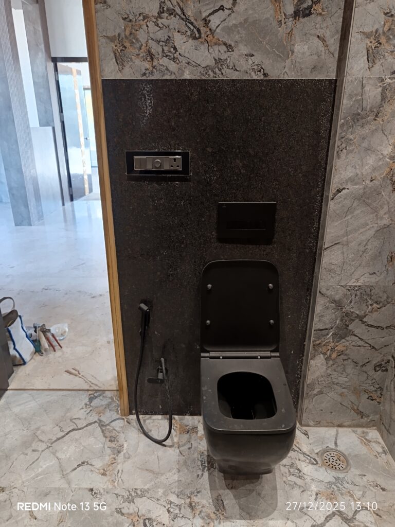 Black wall mounted commod plumber bhai